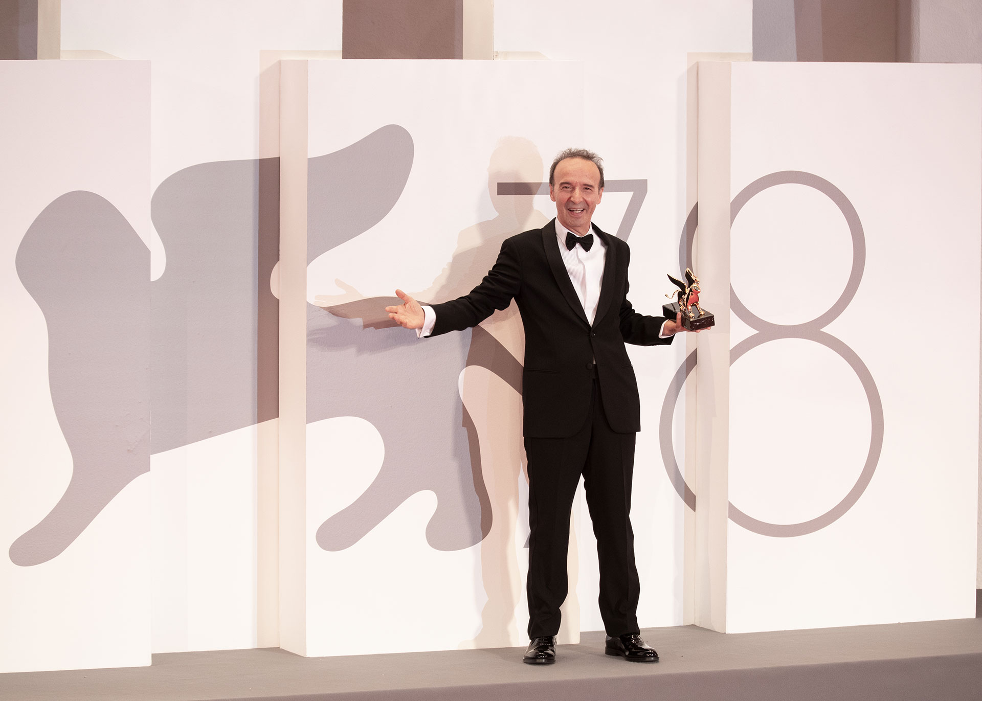 Roberto Benigni poses with the Golden Lion for lifetime achievement during the opening ceremony during the 78th Venice International Film Festival on September 01, 2021 in Venice, Italy.