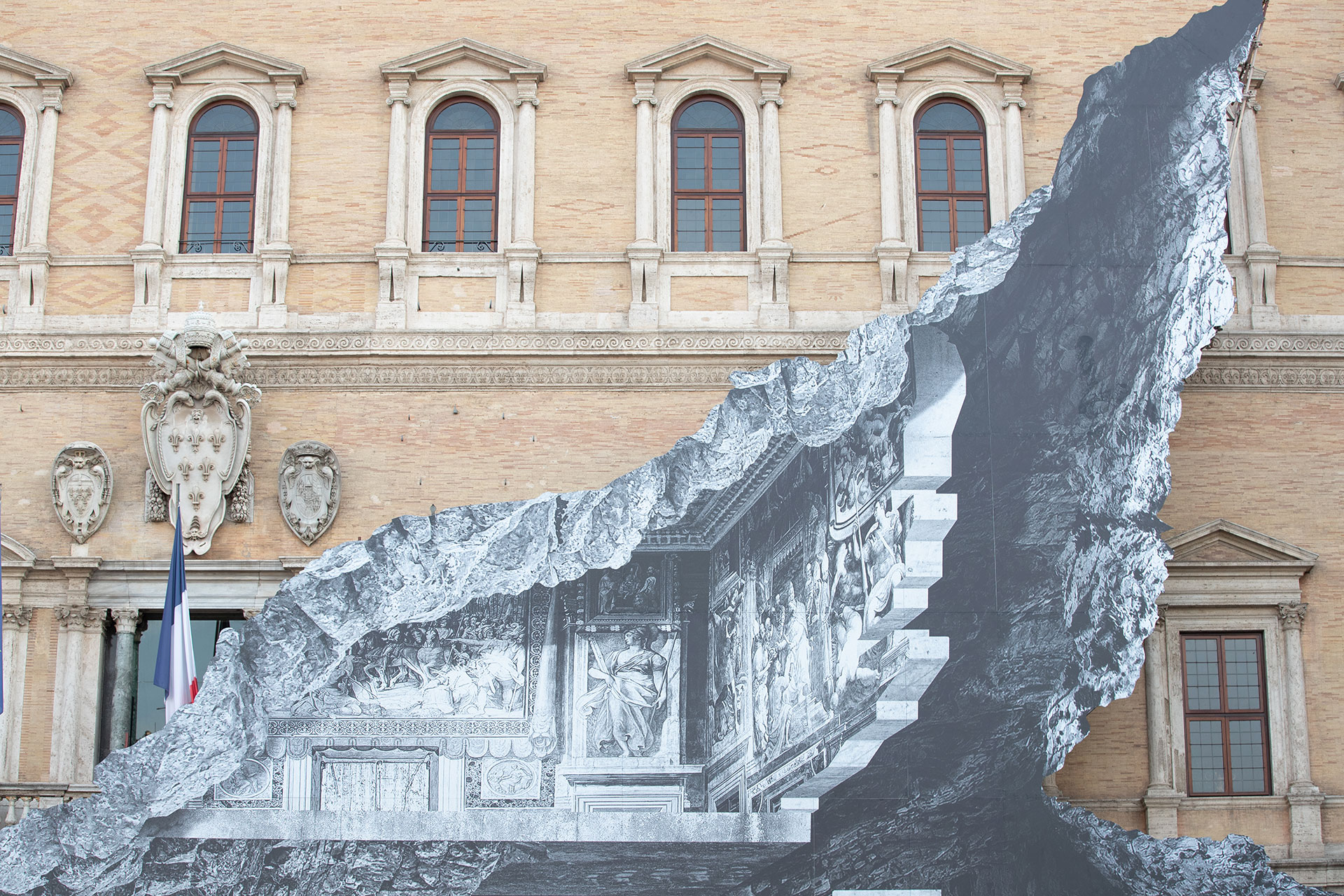 An Art installation on the facade of Palazzo Farnese by French contemporary artist JR shows an optical illusion of a black and white interior of the elegant Renaissance building in Rome, July 24 2021